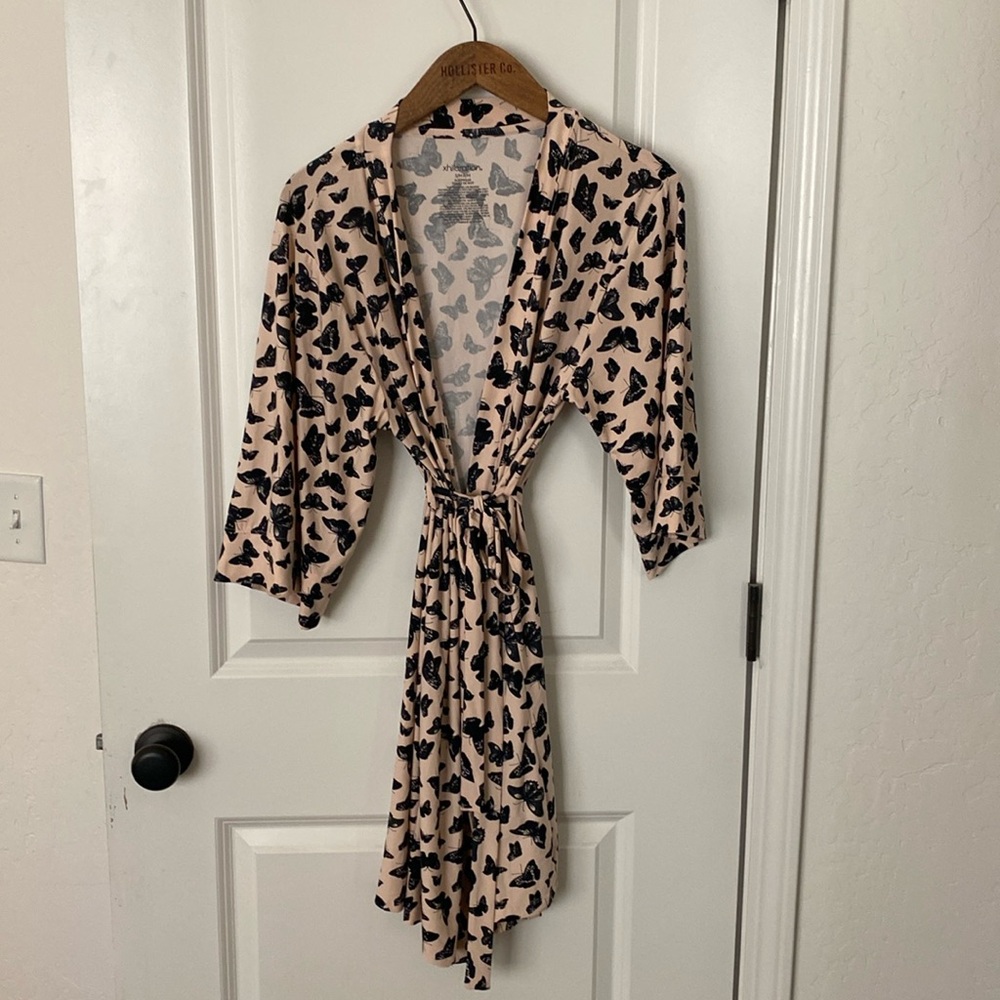 Xhilaration brand light pink with black butterflies robe. Size small.